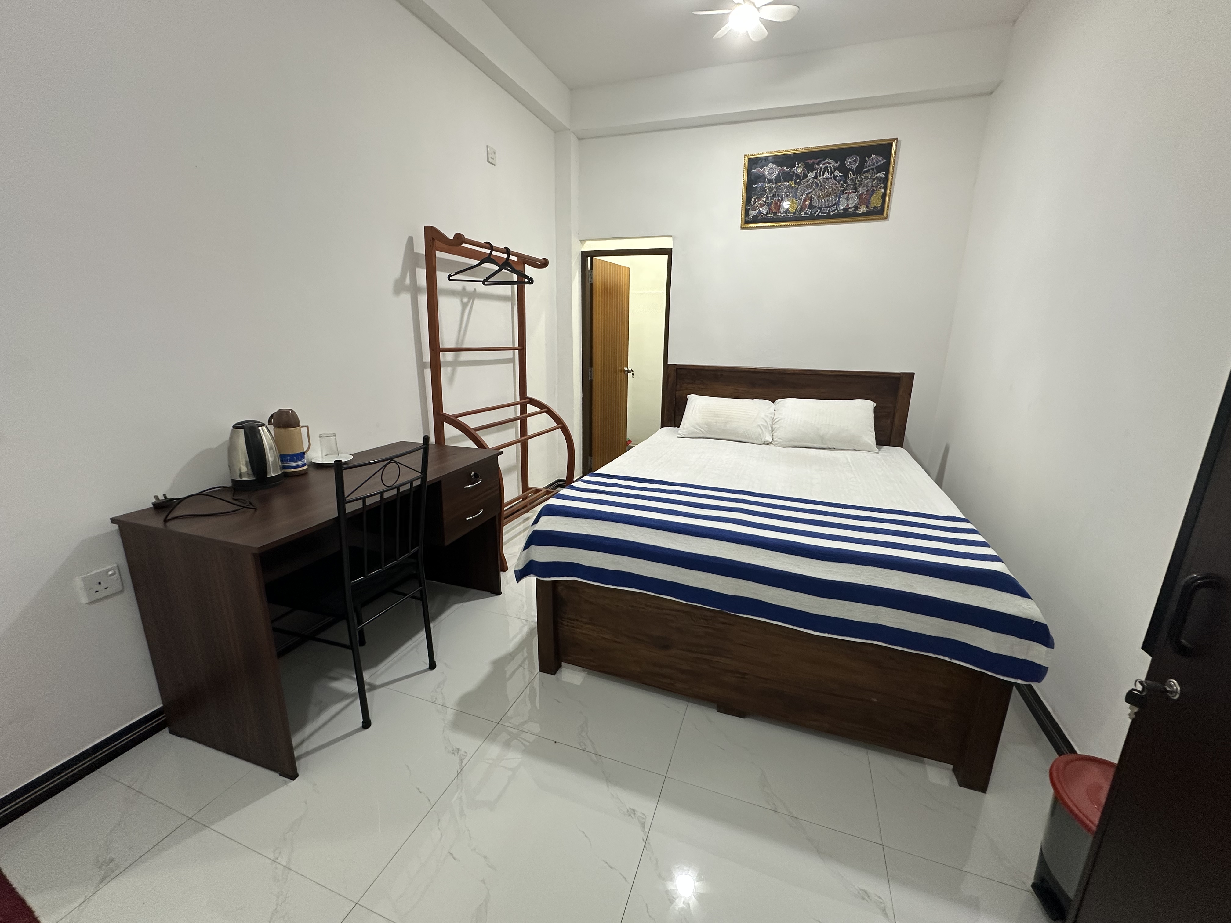 Double Room with a comfortable double bed and work desk at White House Galaha
