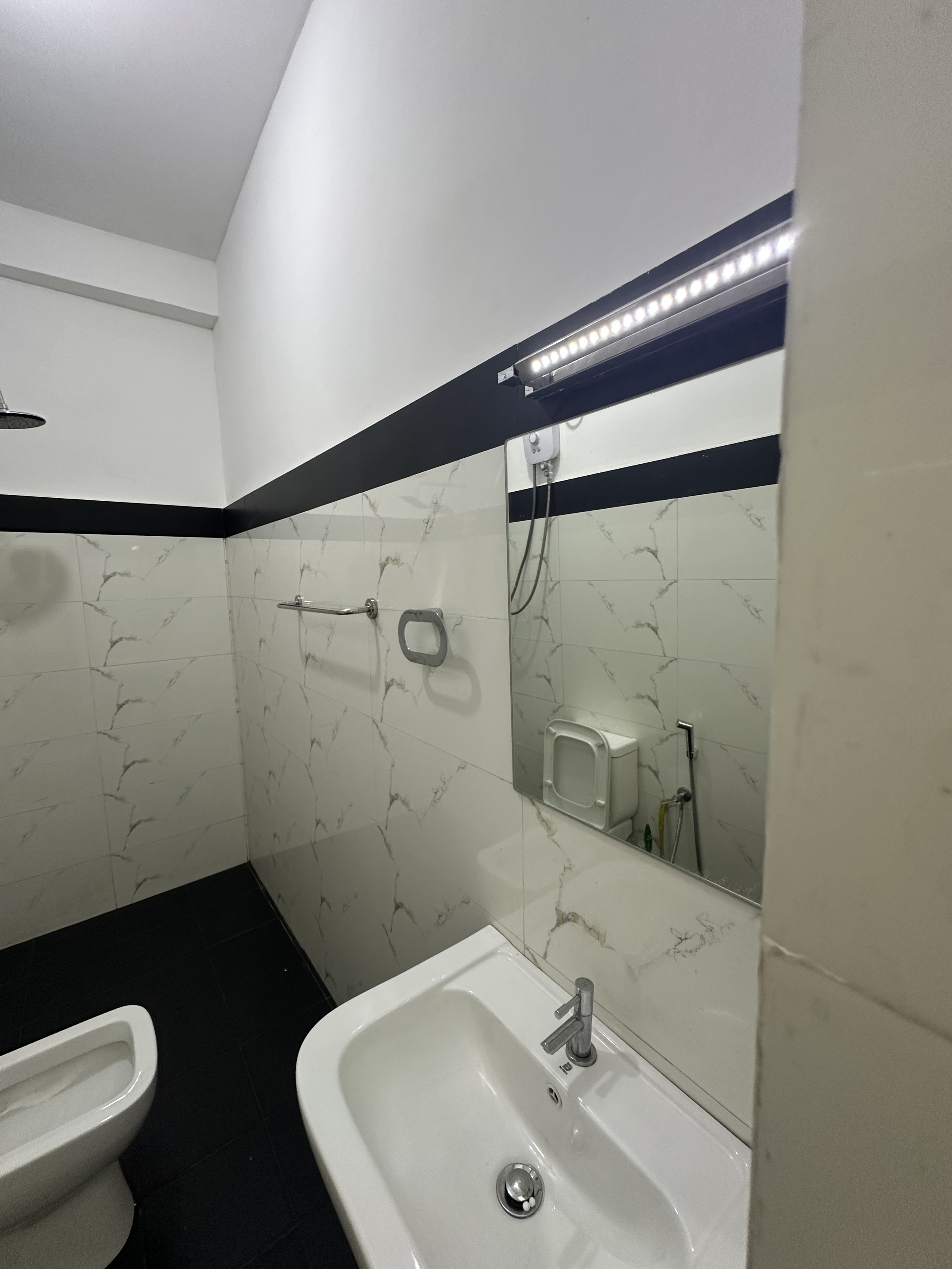 Clean bathroom sink and mirror in the Double Room